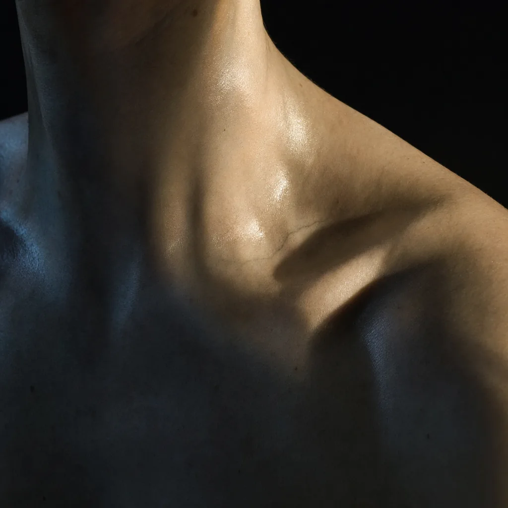 The join of a man's neck, collarbone and shoulder.